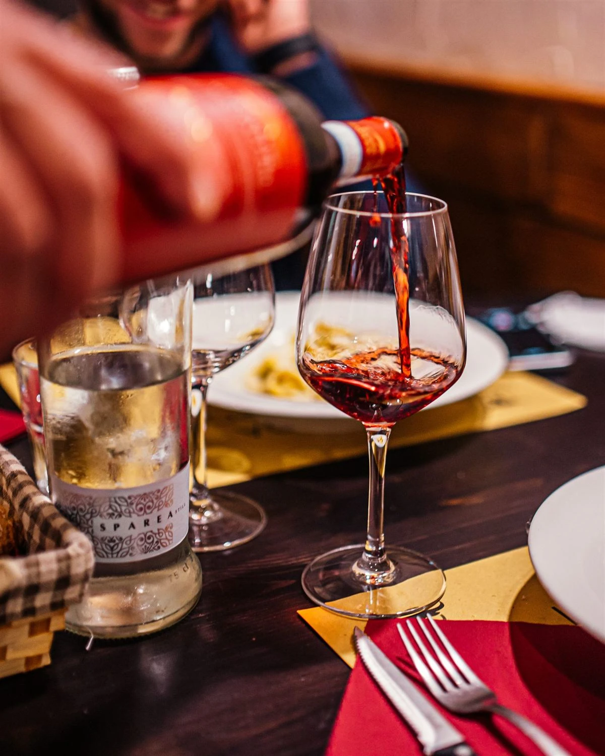Red wine poured into a glass at the Locanda Antichi Sapori